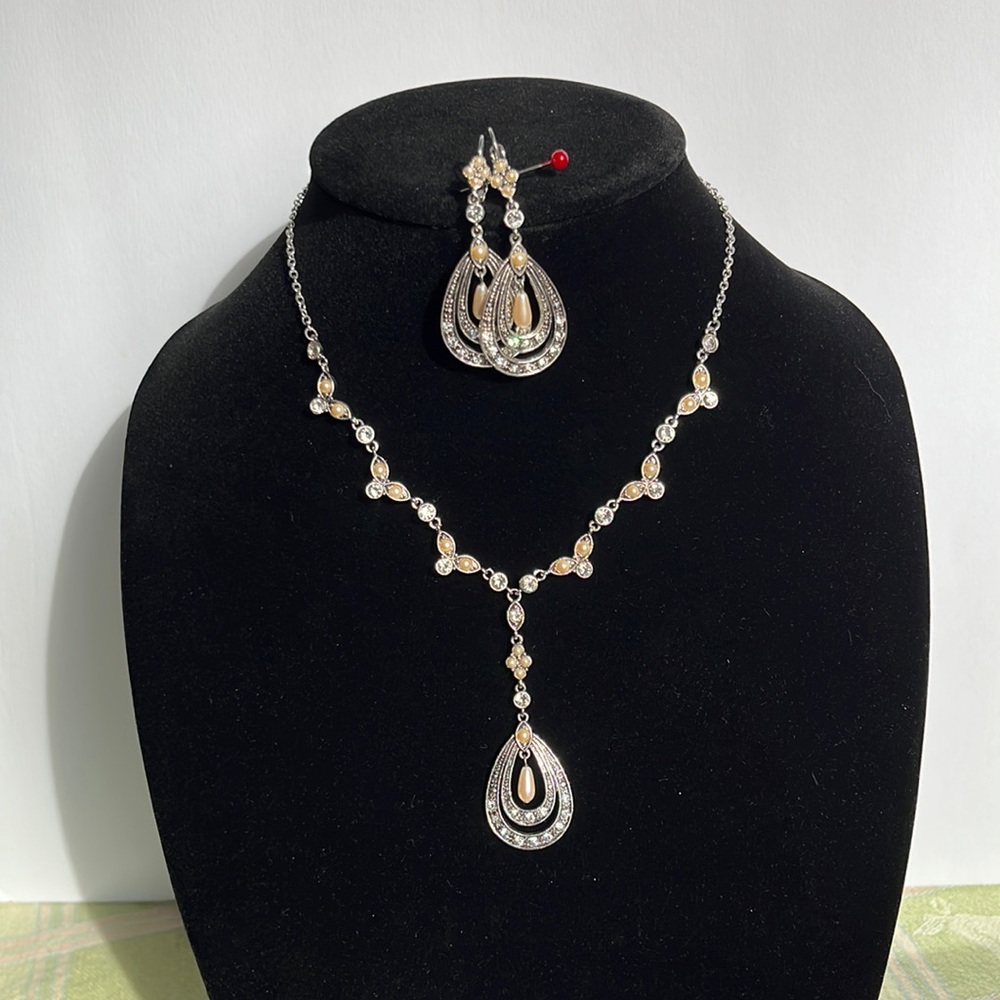 Costume silver, pearl drops and glass crystals necklaces and earrings.